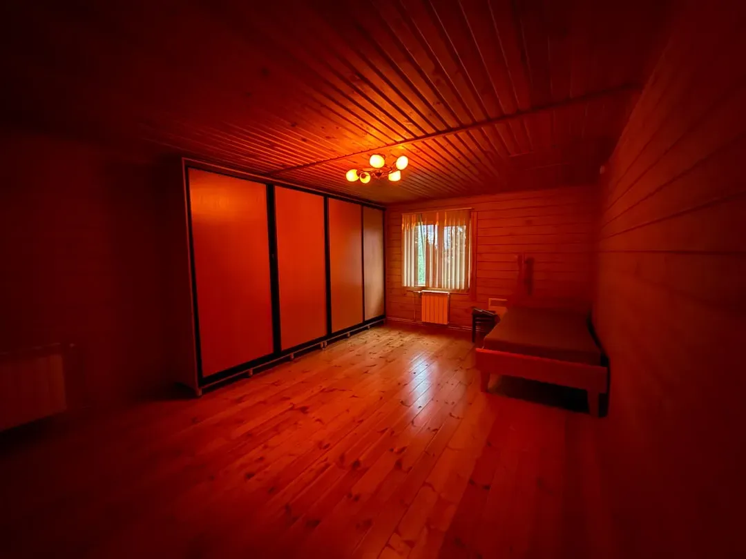 Modern infrared sauna interior with visible heating lamps and sleek design for muscle recovery benefits