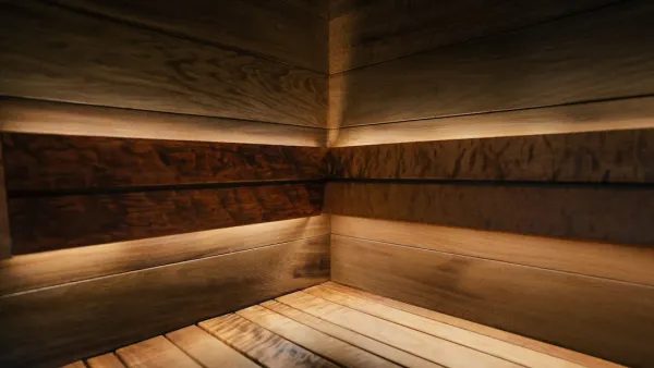 Traditional Finnish wooden sauna with rising steam, wooden benches, and golden lighting creating a peaceful wellness atmosphe